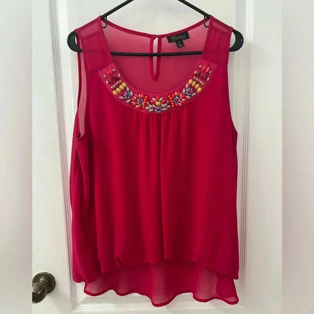 Thalia Sodi of Macy’s hot pink sleeveless blouse with colorful stud detail.